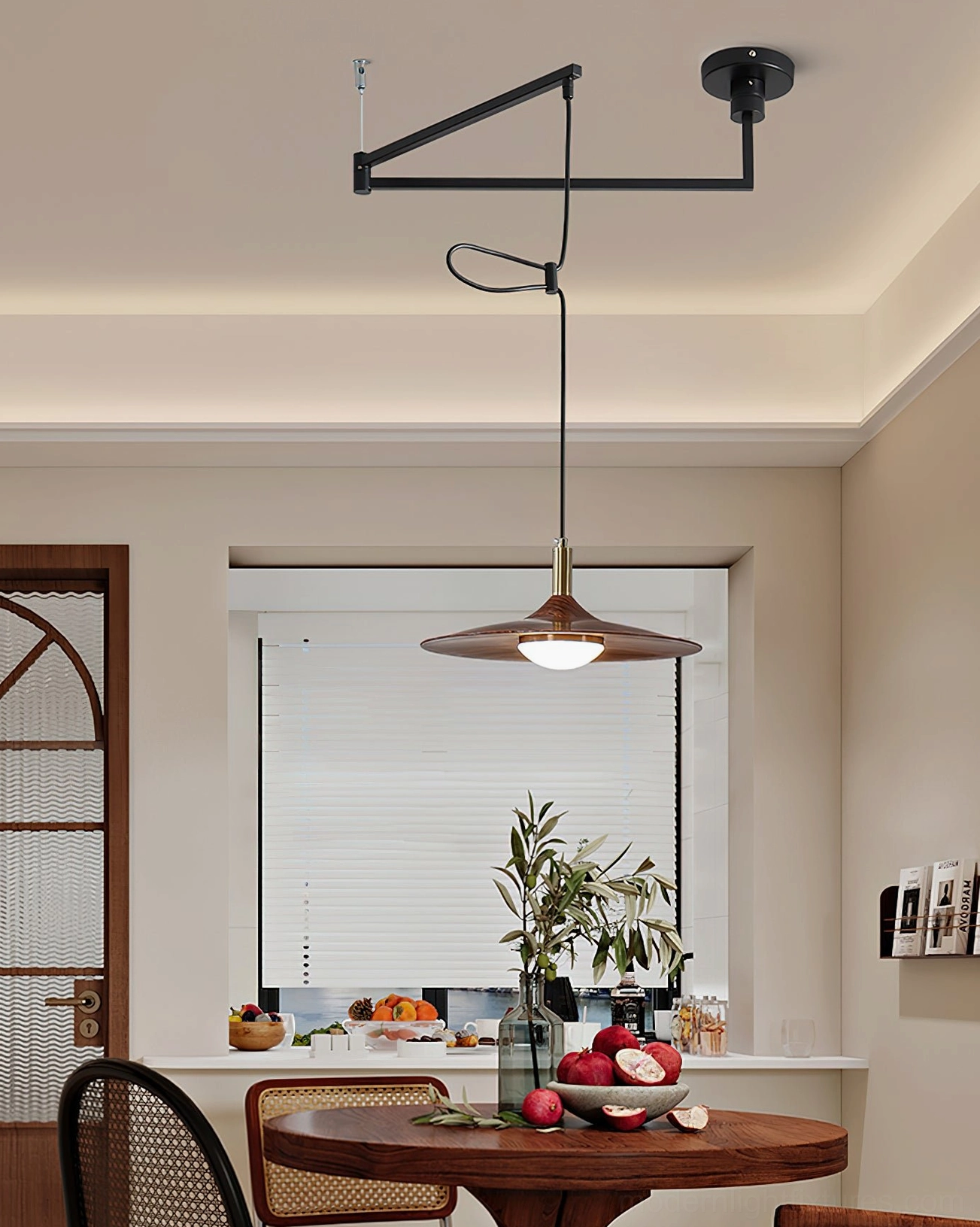 Swing arm pendant light in kitchen dining space with integrated LED glowing warm light