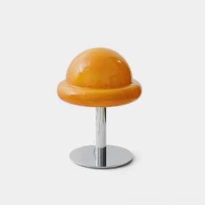 Kleine mushroom glass table lamp with glossy amber shade and polished chrome metal stand, front studio view