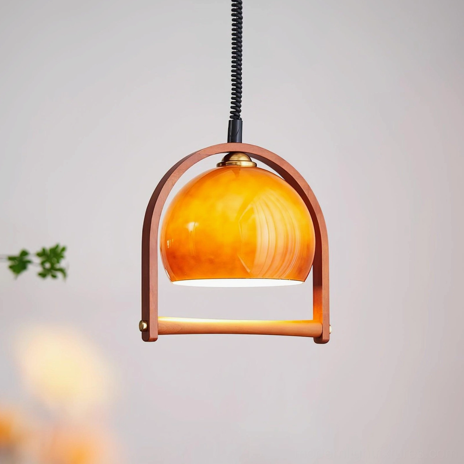 Kleine adjustable pendant light brown finish with warm ambient glow in home interior