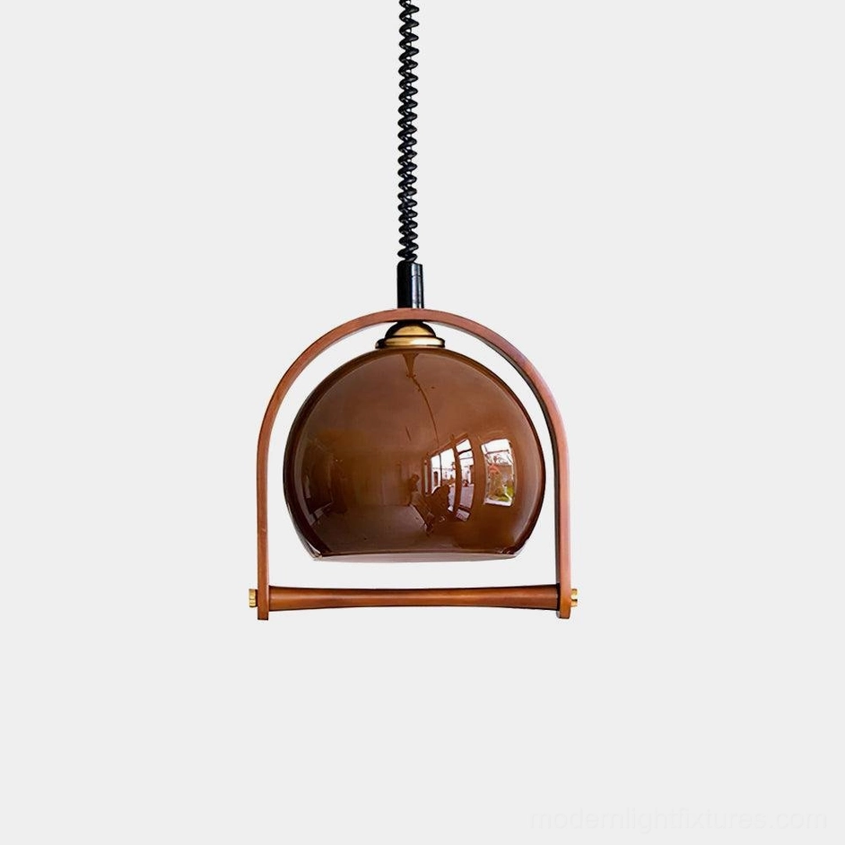 Kleine adjustable pendant light with brown glossy spherical glass shade and wooden arched frame against white studio background