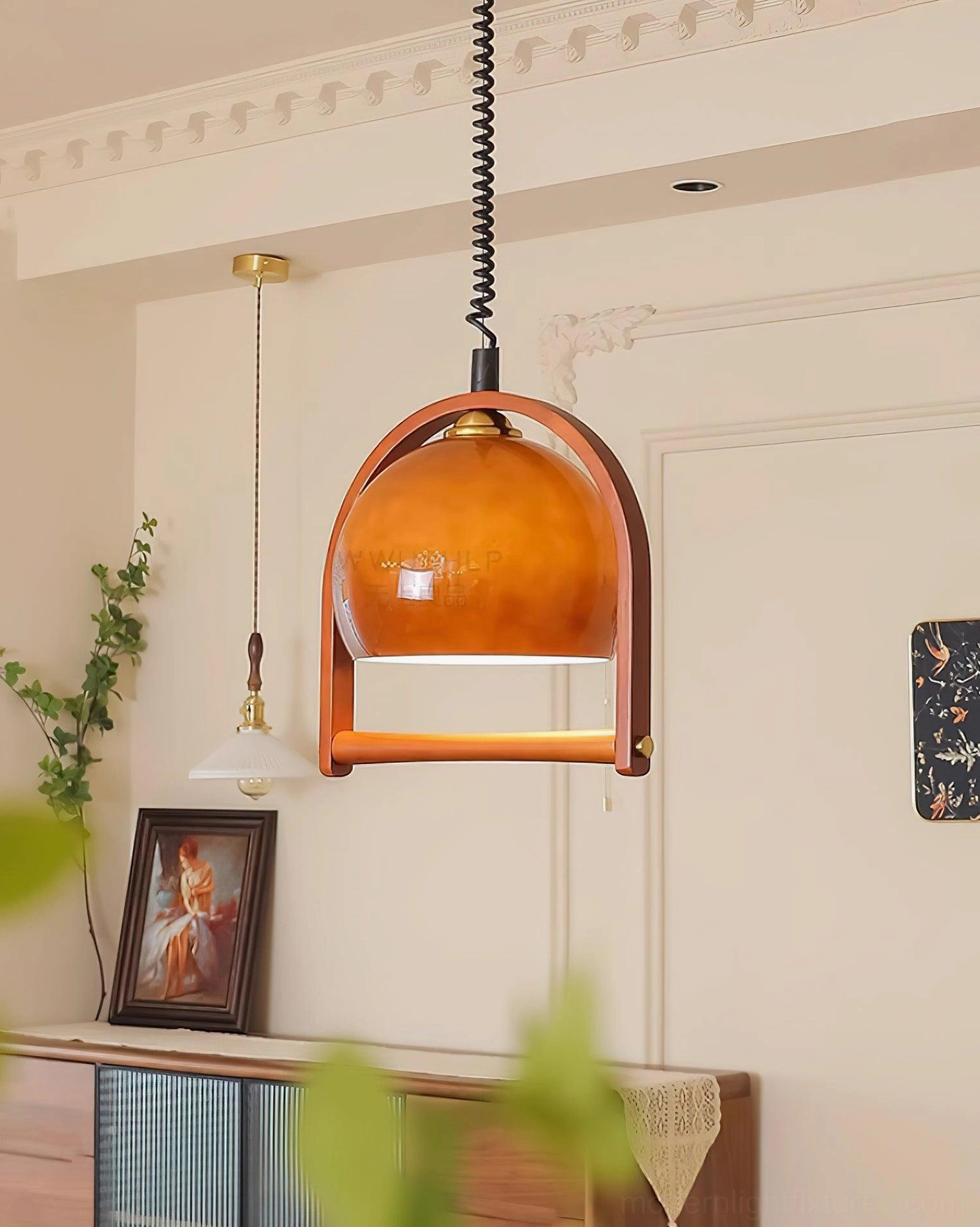 Kleine adjustable pendant light with brown glass shade and metal-wood frame construction detail