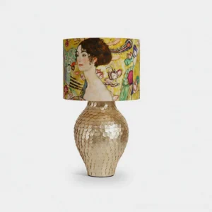 Klimora artistic table lamp with hand-textured golden scaled base and vintage portrait illustrated shade, studio product photography