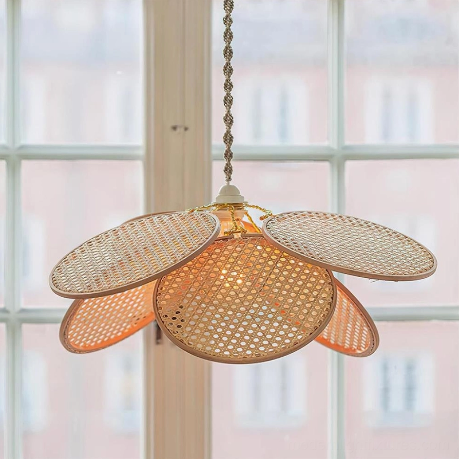 Handwoven natural rattan petal pendant light close-up detail showing braided petal sections and interior lamp structure