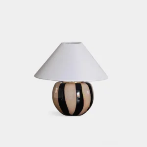 Kodhi modern ceramic striped table lamp with black and taupe bands, white linen conical shade, studio front view
