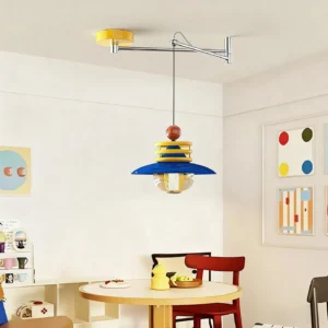 Modern swing arm pendant light installed over round wooden dining table in residential dining room