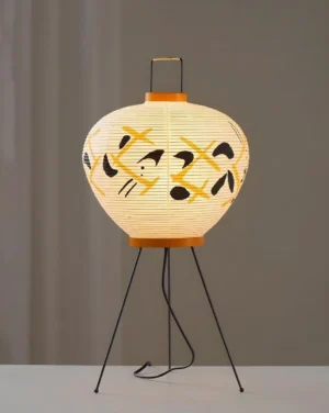 Komori lit Japanese paper lantern table lamp with warm ambient glow, black geometric pattern on rice paper shade