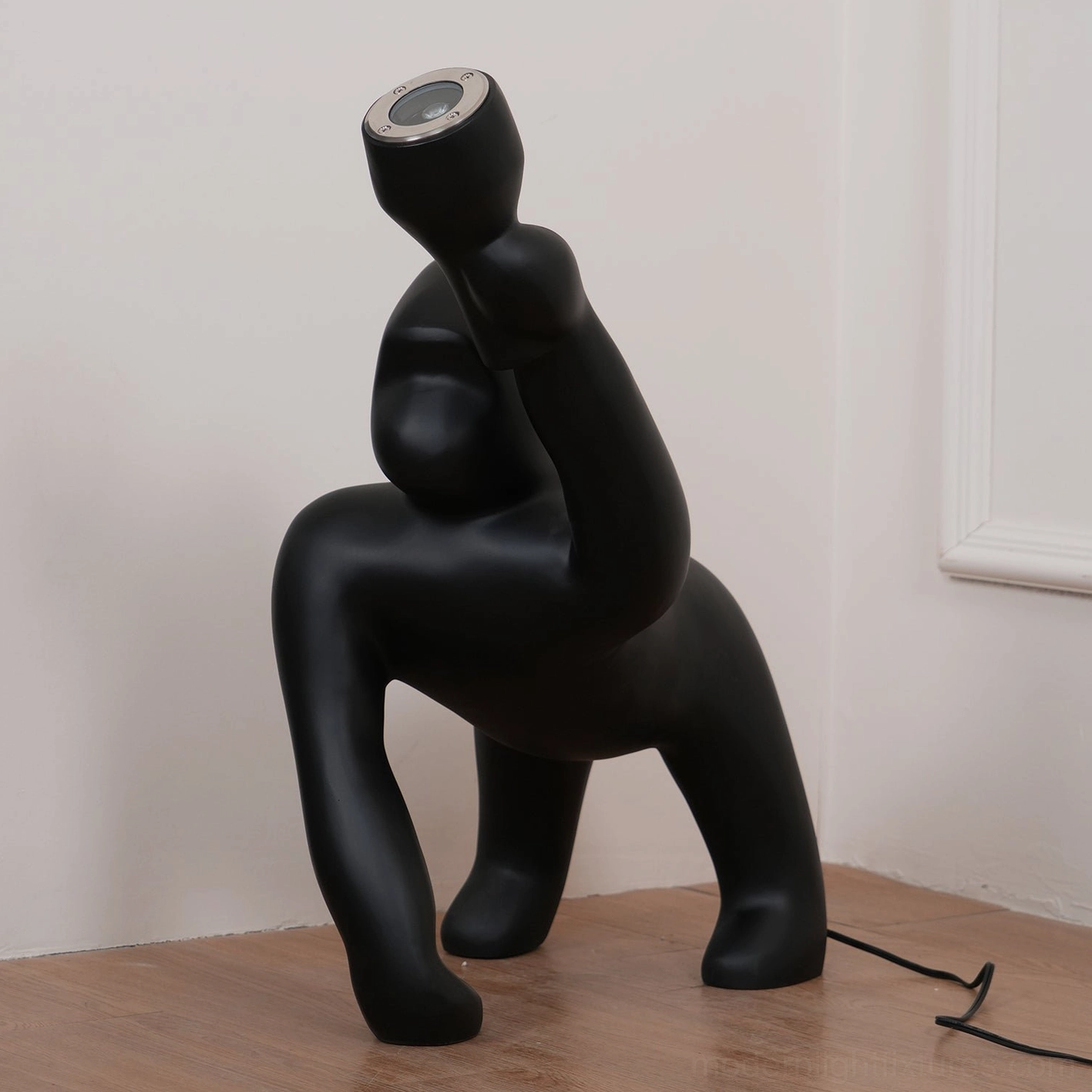 Kong floor lamp full view showcasing complete sculptural design from ground to extended arm light fixture positioning
