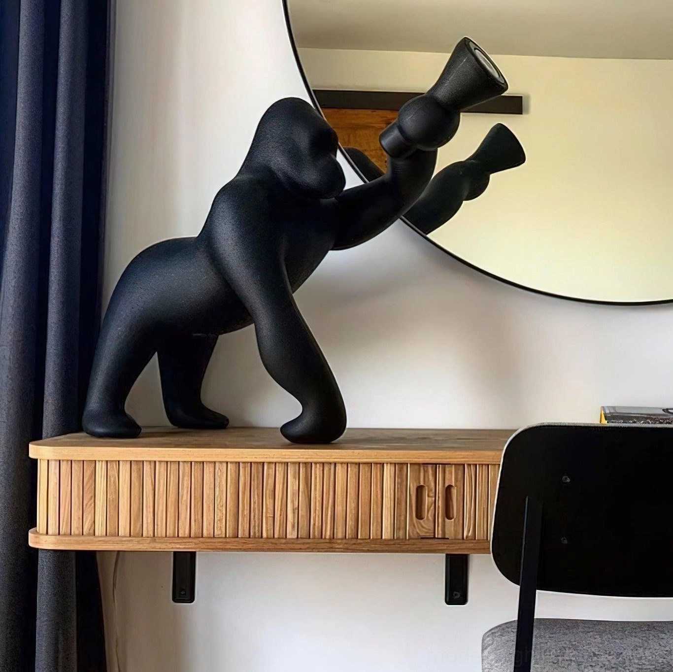 Kong sculptural floor lamp in industrial modern design space, showcasing raw materiality and dramatic artistic presence