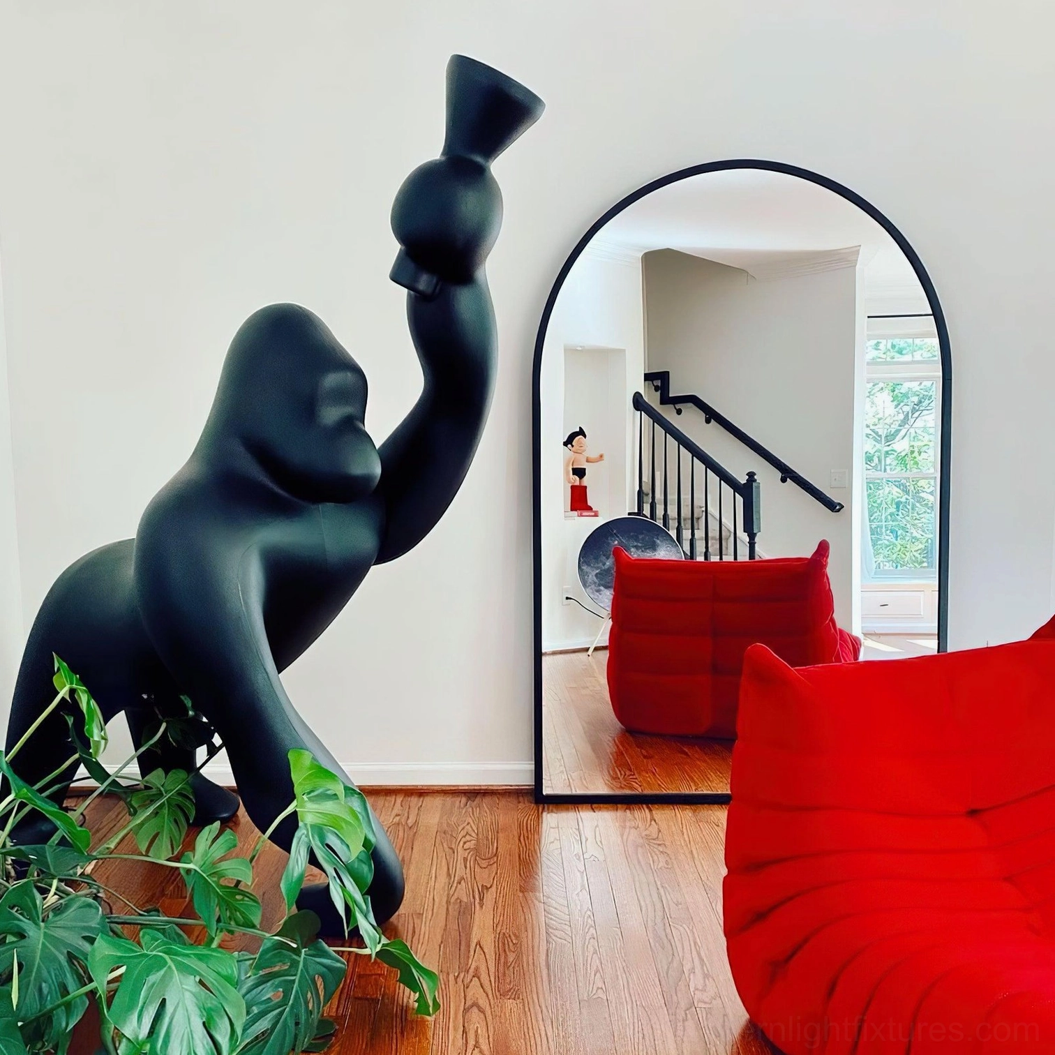 Kong floor lamp in post-modern design setting, featuring playful artistic subversion and unconventional material expressions