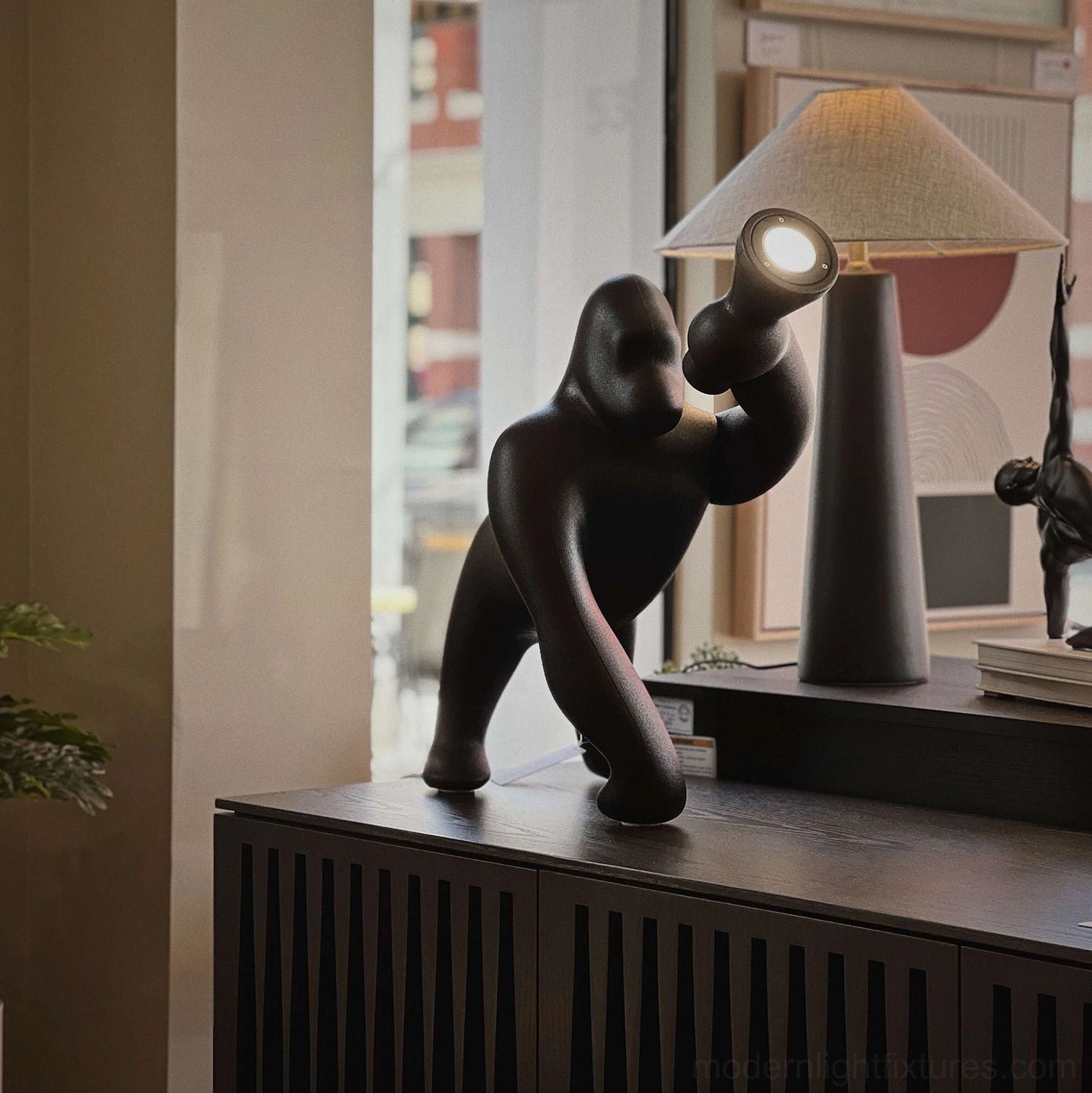 Kong sculptural floor lamp lightweight resin construction demonstration and durability characteristics for long-lasting use