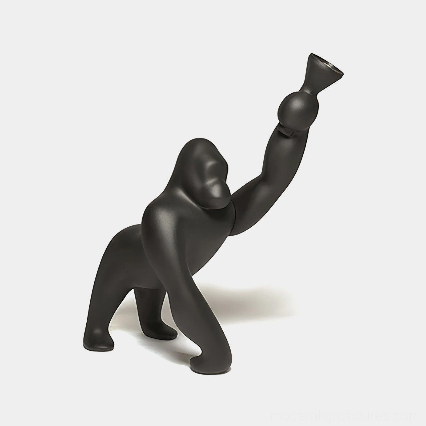 Kong sculptural floor lamp in matte black resin, side three-quarter view showcasing artistic animal-inspired design and modern minimalist aesthetic