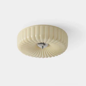 Cream Kranos fluted glass ceiling light fixture, overhead close-up view showing ribbed texture and chrome mounting base