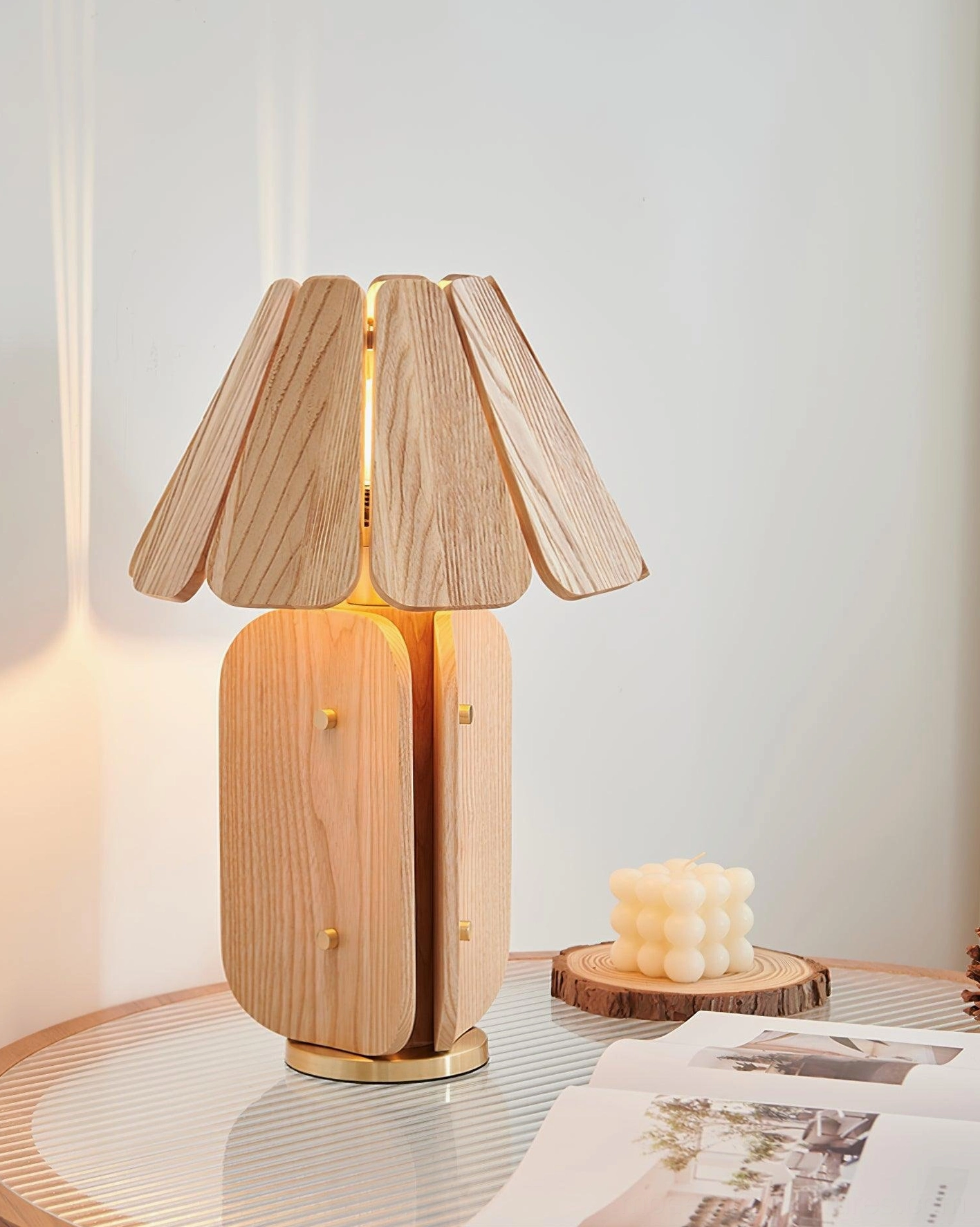Kubec table lamp illuminated showing geometric light patterns from slatted shade design