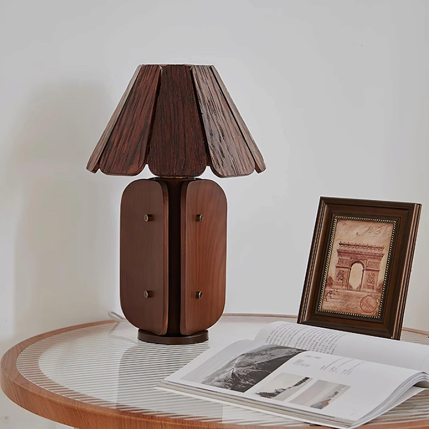 Kubec wood lamp casting soft shadows on wall in evening home setting