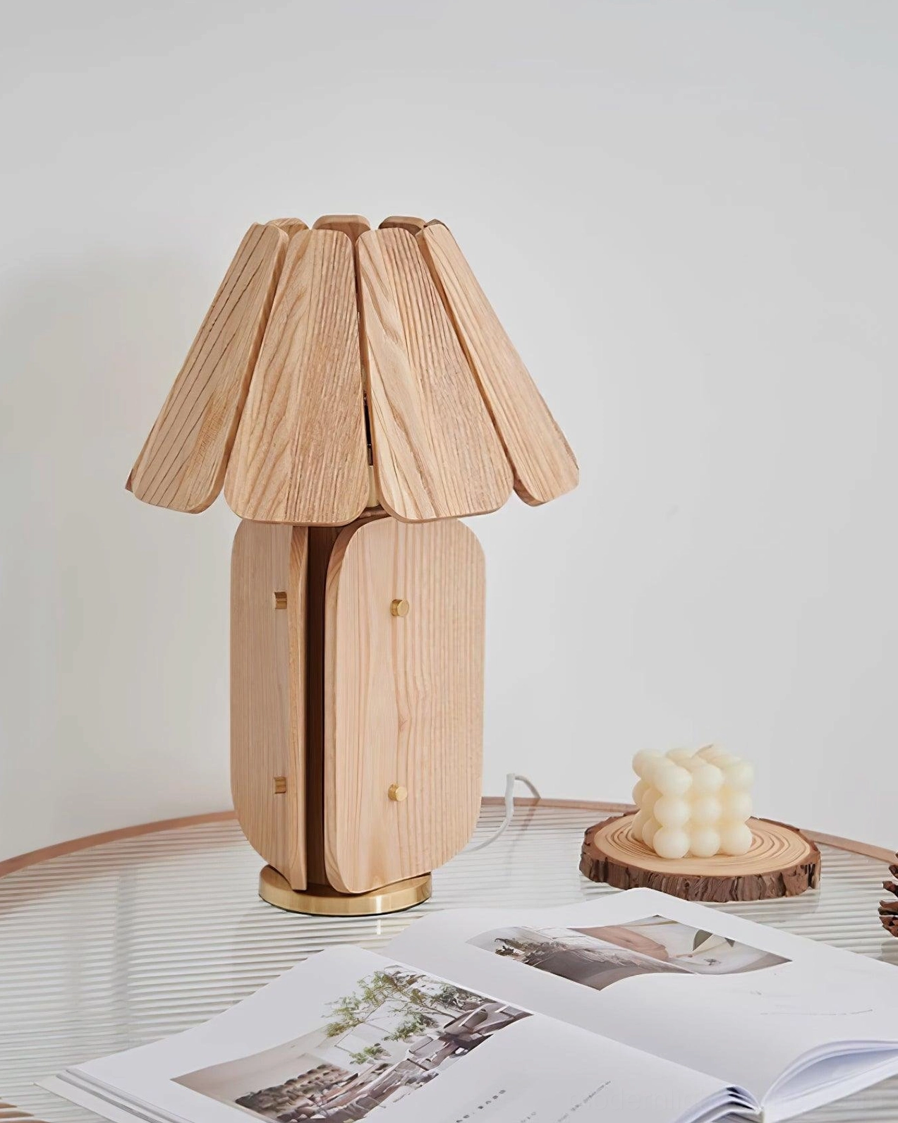 Kubec ash wood table lamp on reading nook side table with warm illumination