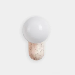 Kyomi travertine wall sconce with frosted glass globe, front studio view showing minimalist sculptural design