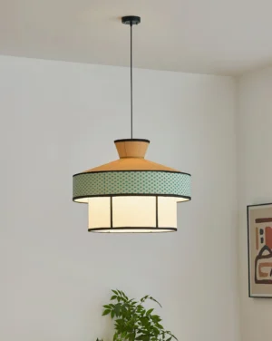 Modern fabric pendant lamp with three-quarter angle view, black suspension cord, warm ambient lighting from interior