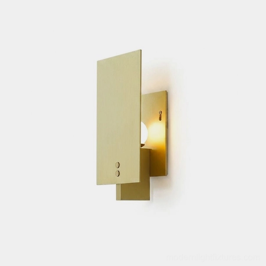 Kyren minimalist brass wall sconce front view close-up showing geometric rectangular form and clean lines