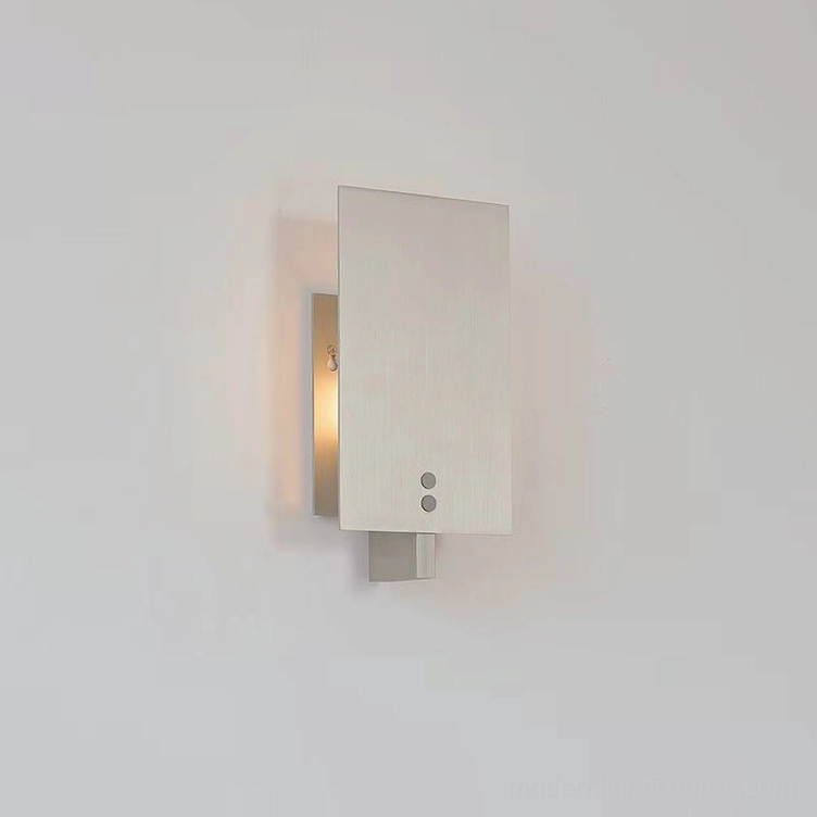Kyren wall sconce illuminated at night showing shadow play and ambient glow effect