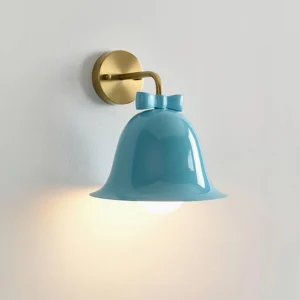 Lake blue bell-shaped wall lamp with brass bracket and bow knot accent on white background