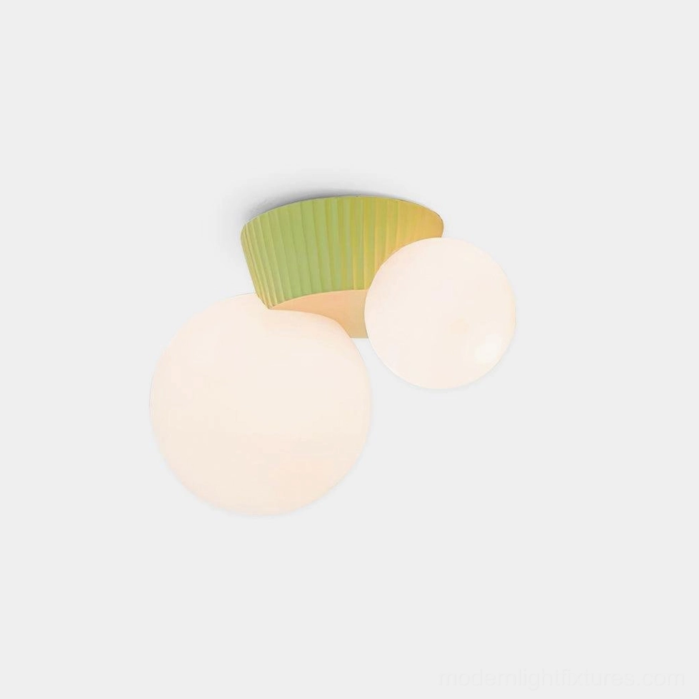 Land mineral-textured resin ceiling light with dual spheres in close-up studio view