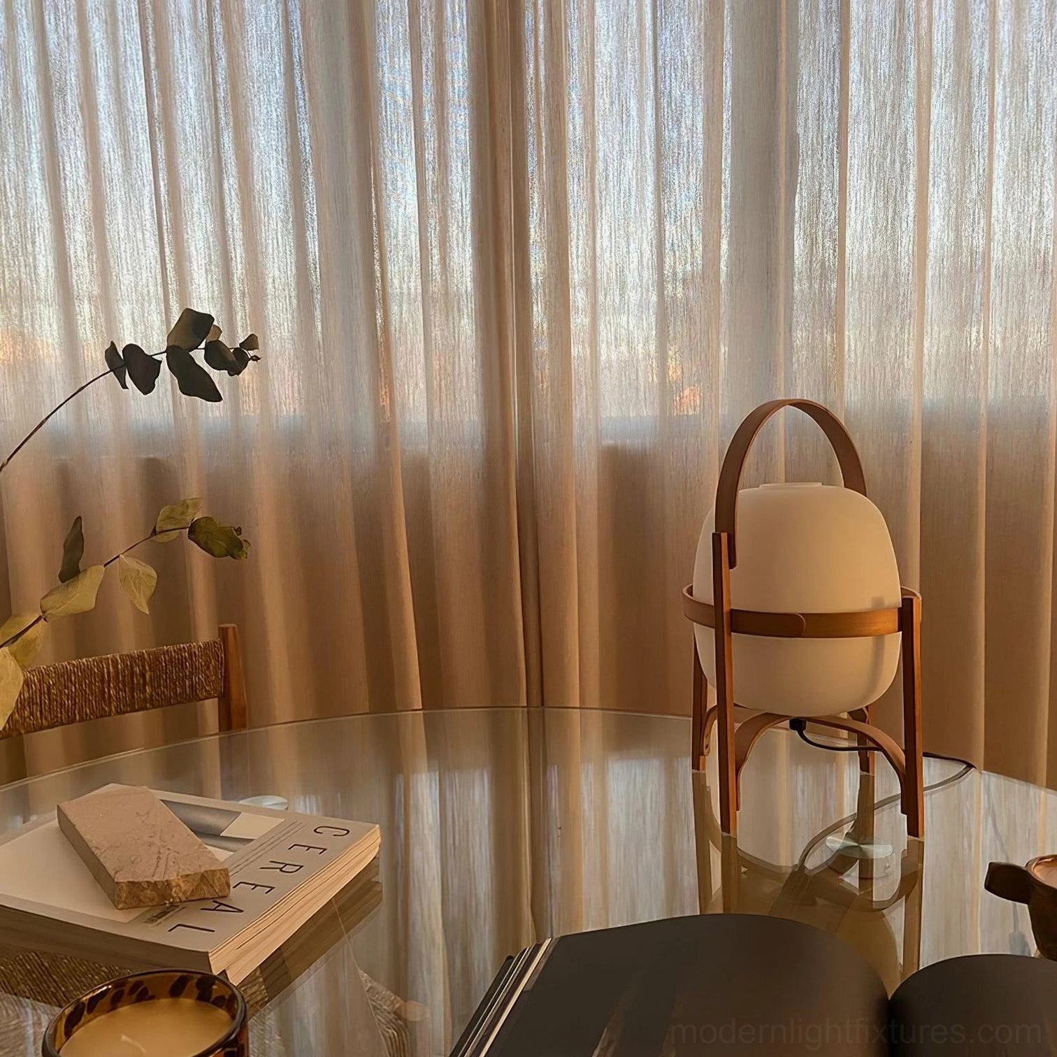 Lantern glass table lamp creating soft diffused light in living space