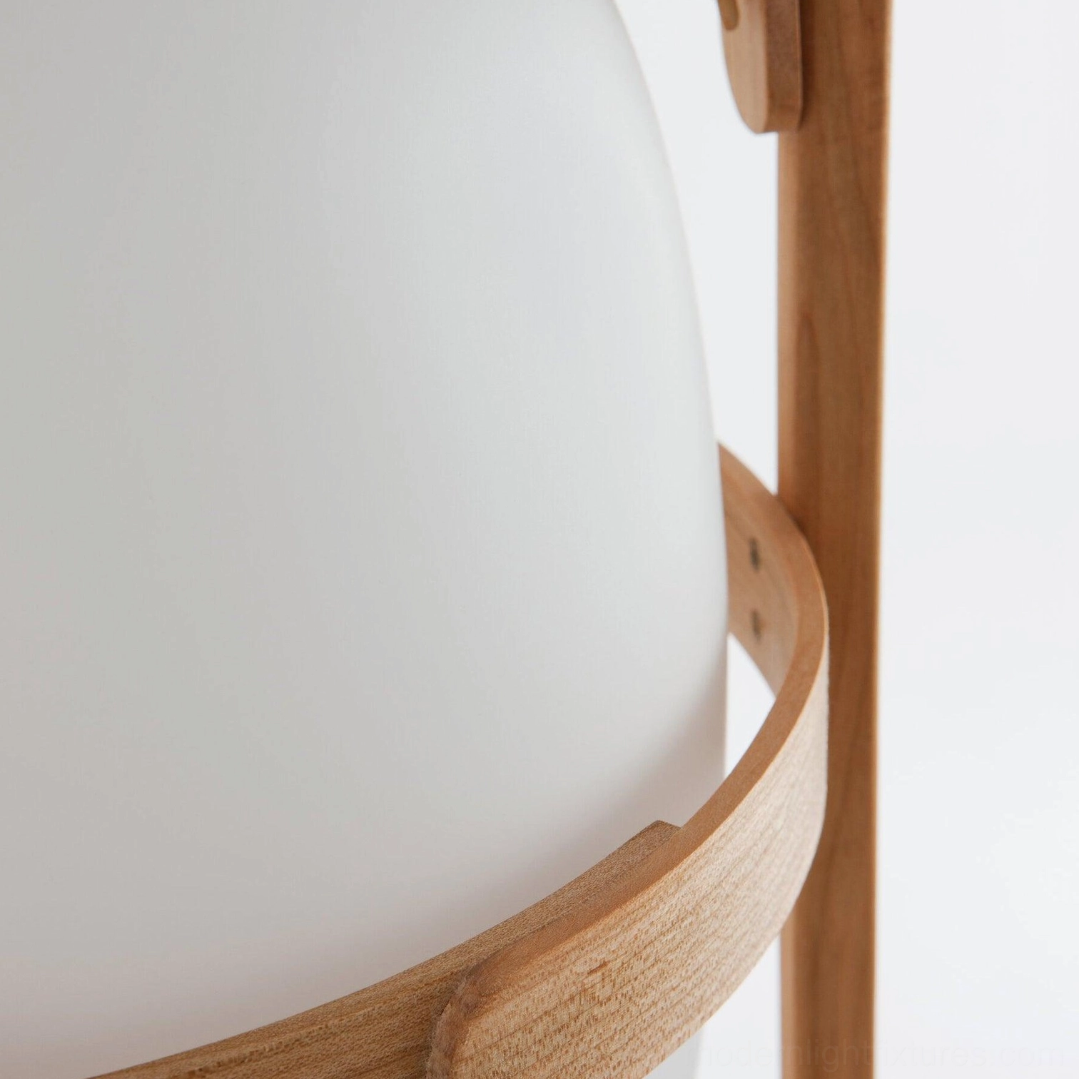 Frosted glass shade detail of portable lantern table lamp with warm light glow