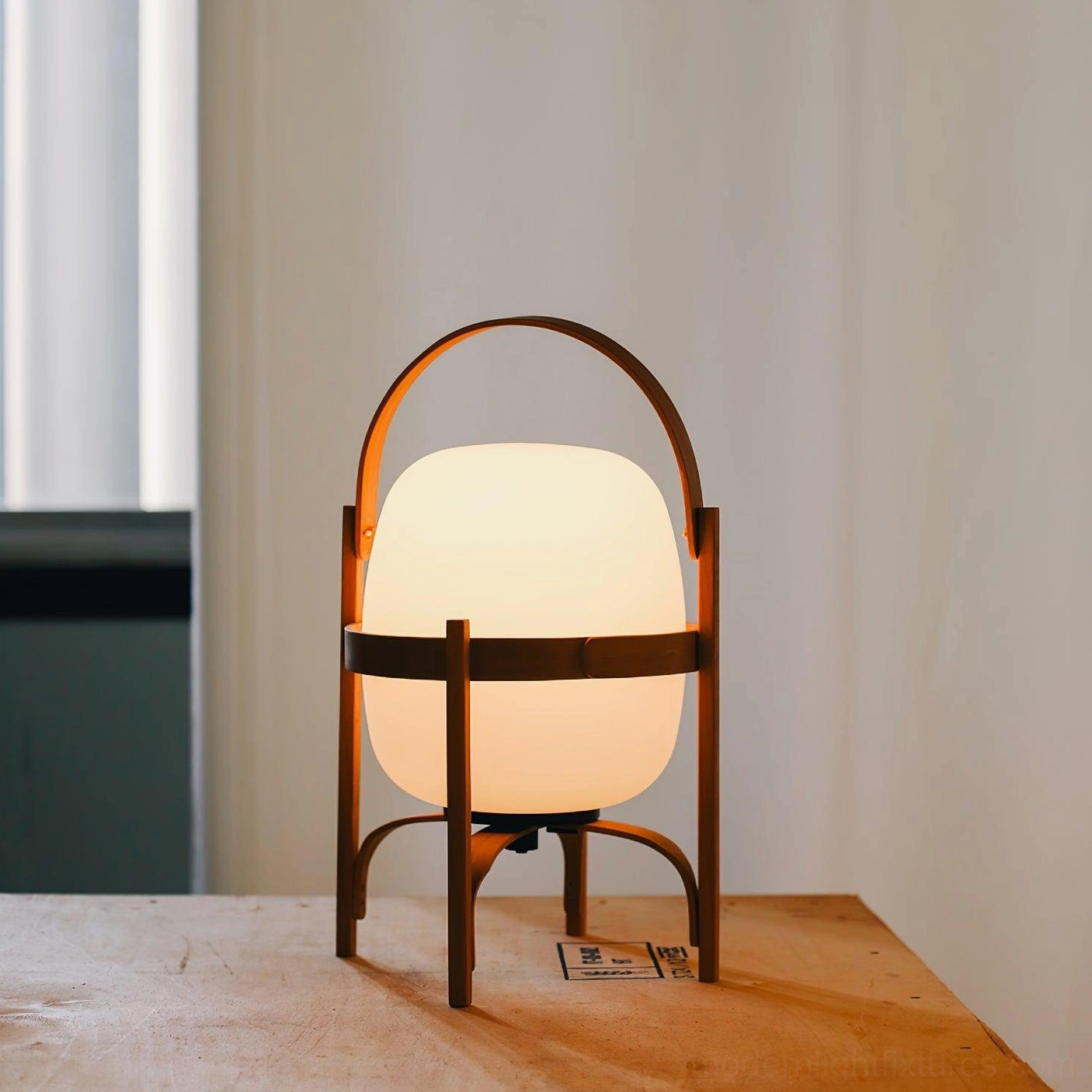 Modern portable lantern table lamp paired with home decor accessories