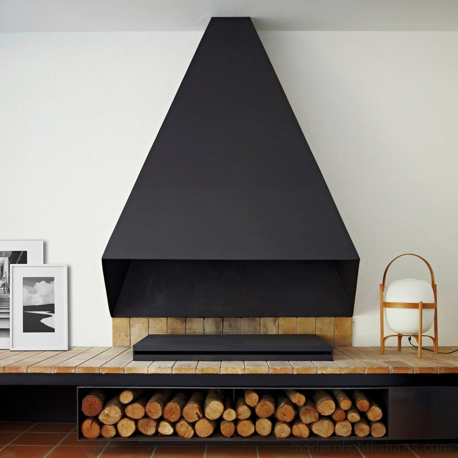 Portable lantern lamp displayed on fireplace mantel in modern lounge setting