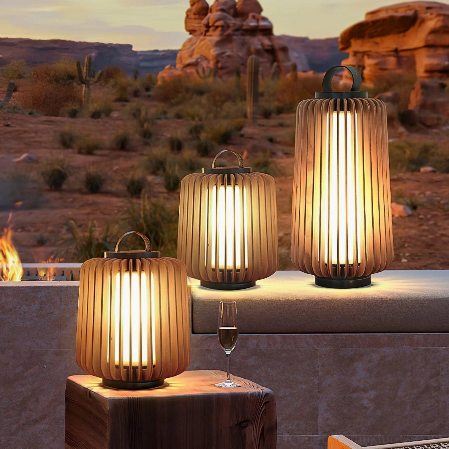 Set of multiple Lanvera rechargeable portable lamps on desert terrace outdoor lounge at dusk
