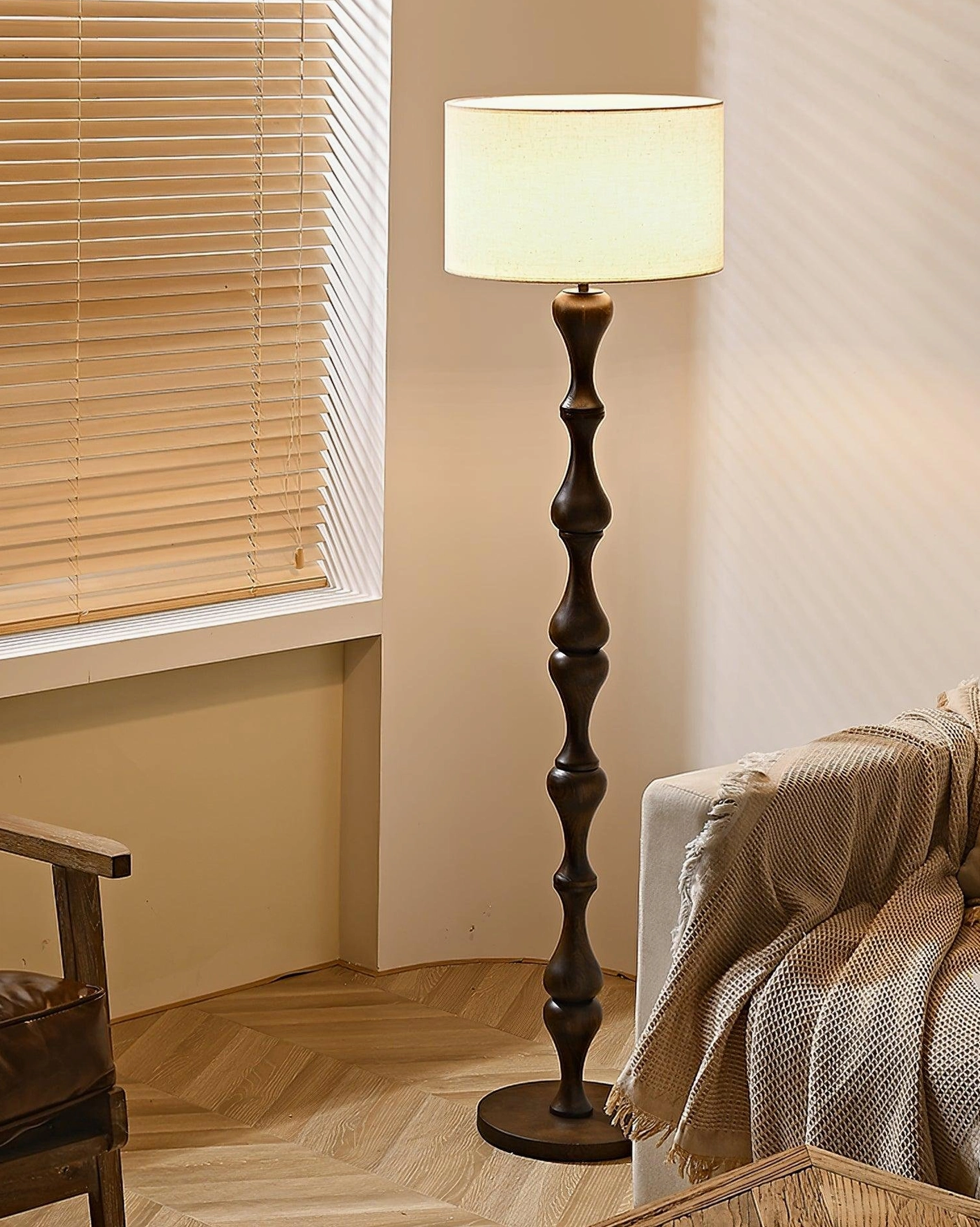 Laredo dark twisted wooden floor lamp with drum fabric shade by window blinds