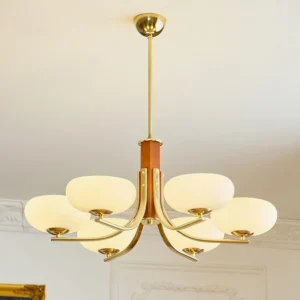 Mid-century modern 8-head pendant chandelier installed in French-style living room with brass finish and wooden details, vintage elegant ambiance