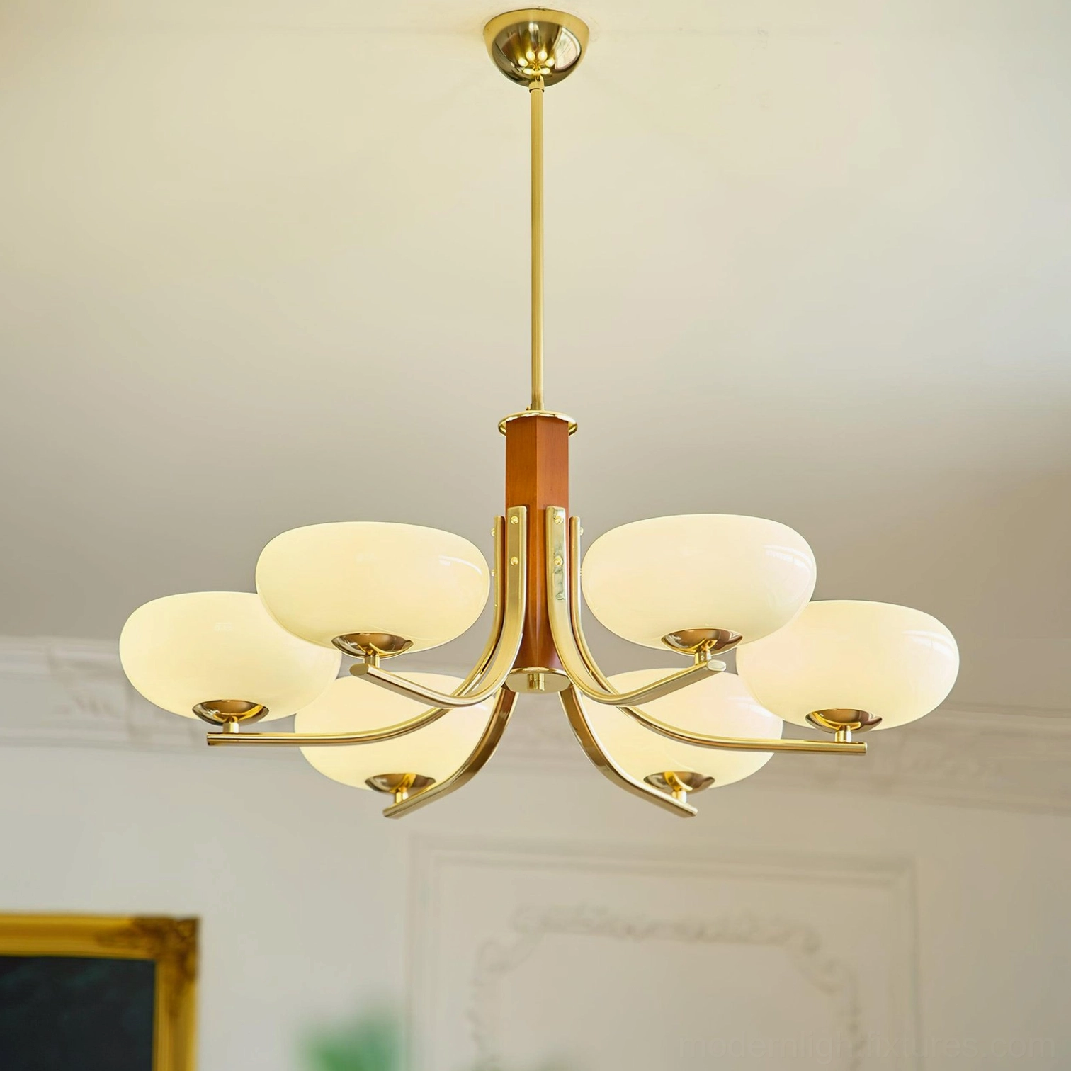 Mid-century modern sputnik chandelier fixture featuring multiple brass arms, wood elements, and translucent glass diffusers