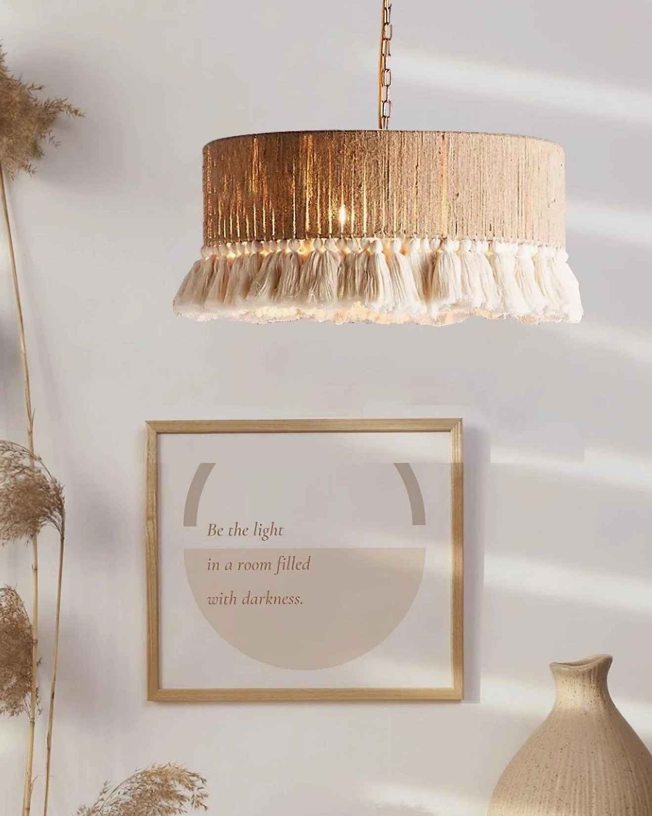 Large boho drum pendant light with off-white tassel fringe in contemporary home setting