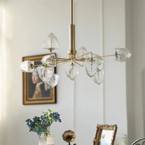 Large brass gold branch chandelier with clear faceted glass lamp shades in luxury residential living room