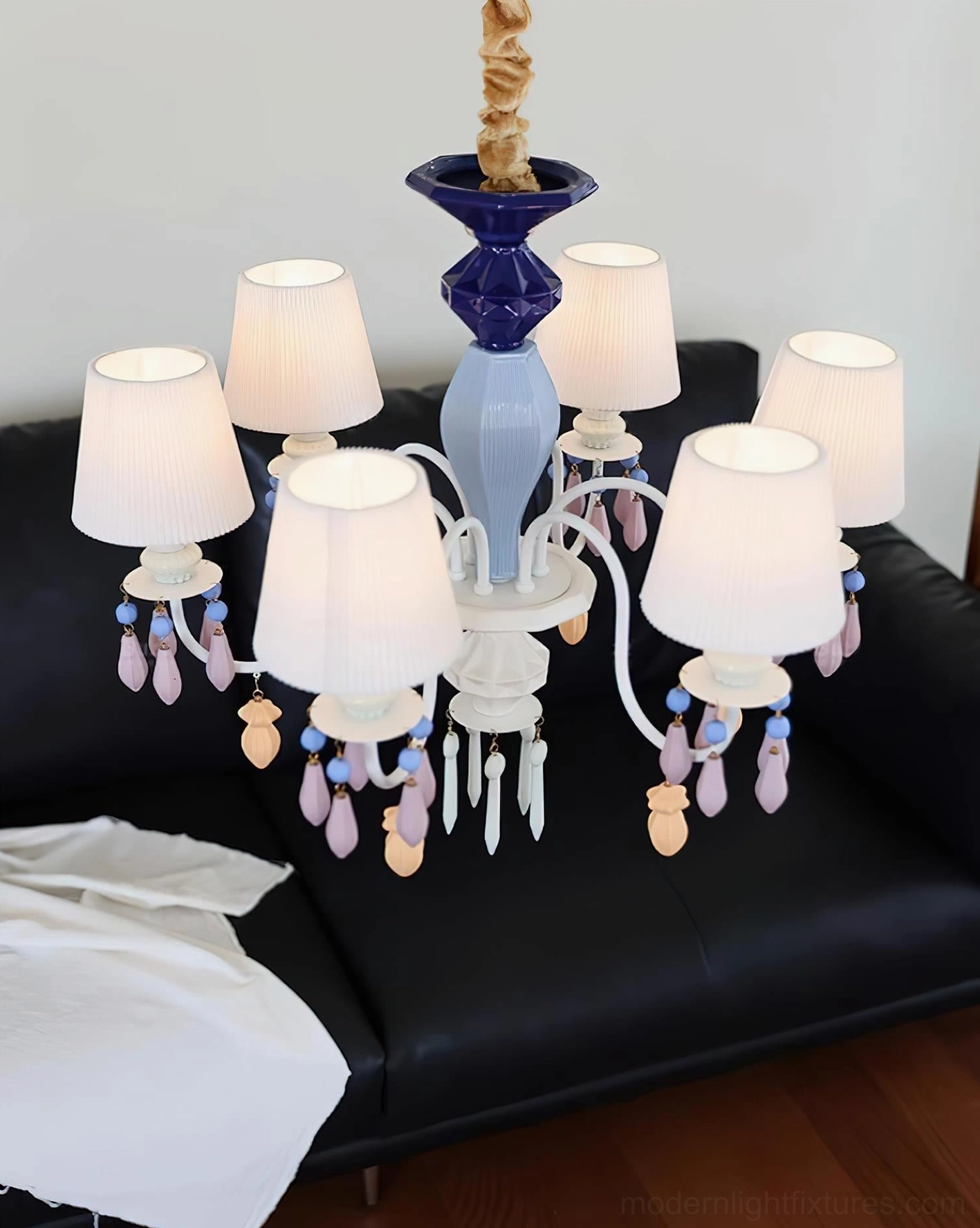 Large 8-arm ceramic chandelier with gradient blue details and colorful crystal pendants in contemporary living room