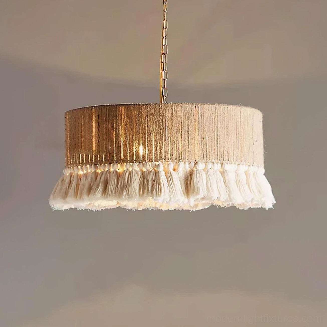 Large drum boho pendant lamp with woven shade and beige tassel fringe, close-up detail view