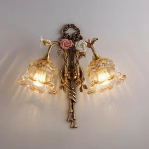 Large Margaux Fleur wall sconce 42cm width brass finish with pink and white ceramic flower details, studio overhead perspective