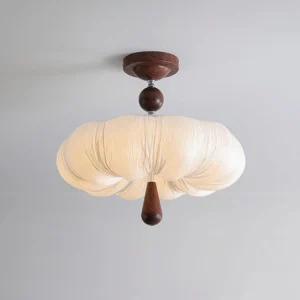 Large Mori Puff contemporary ceiling lamp with full pleated shade and dark wood hardware, modern lighting design studio view