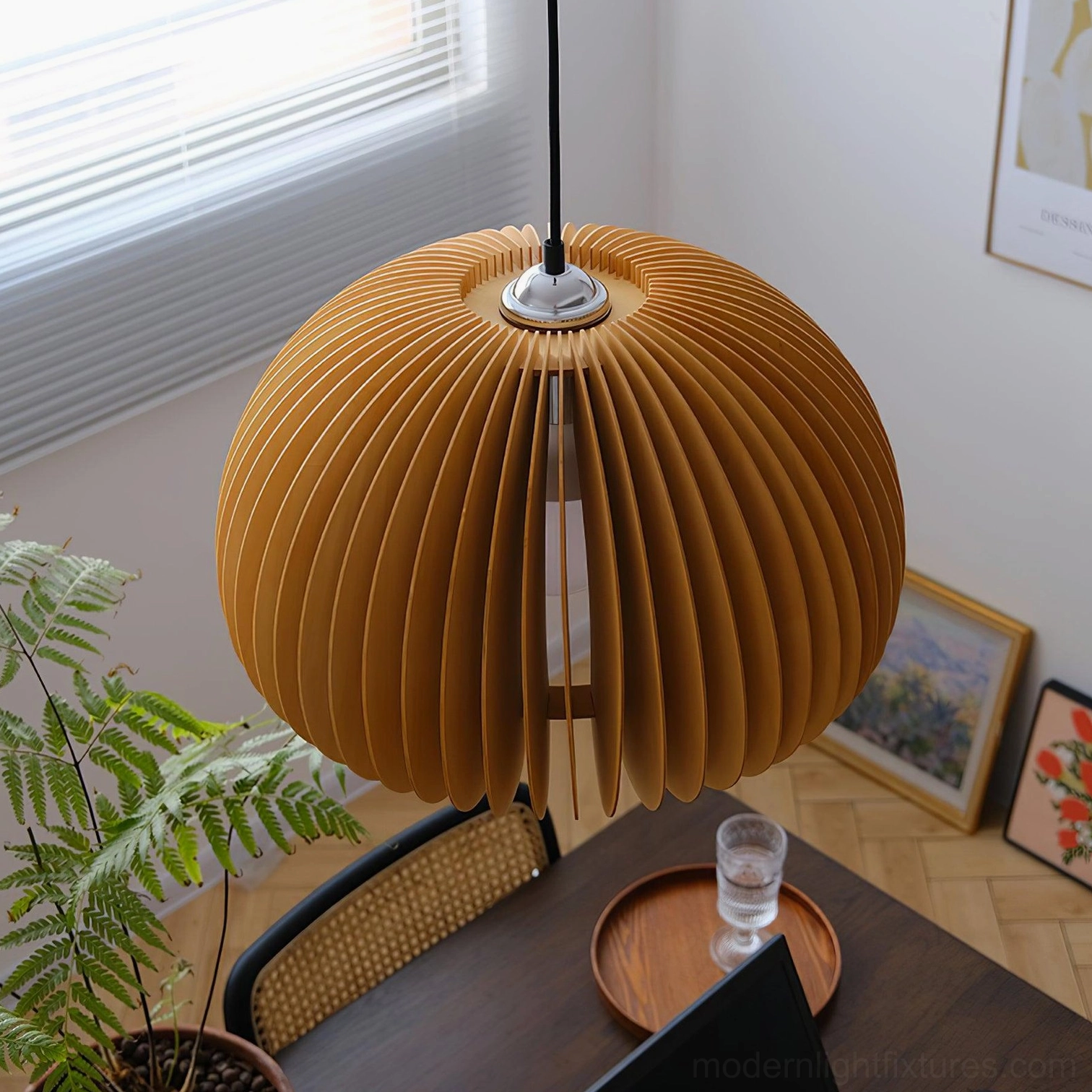 Large natural wood pumpkin pendant lamp with thick vertical slats in residential dining room