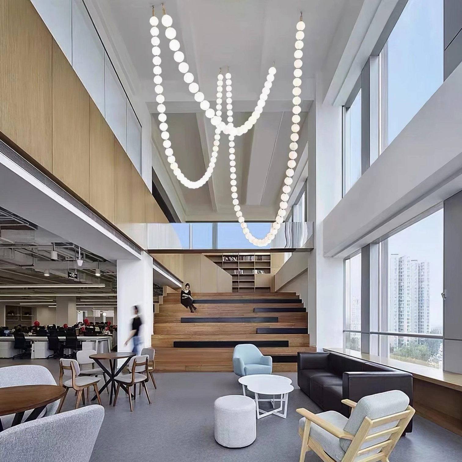 Large-scale wave pearl chandelier in double-height duplex apartment with illuminated design