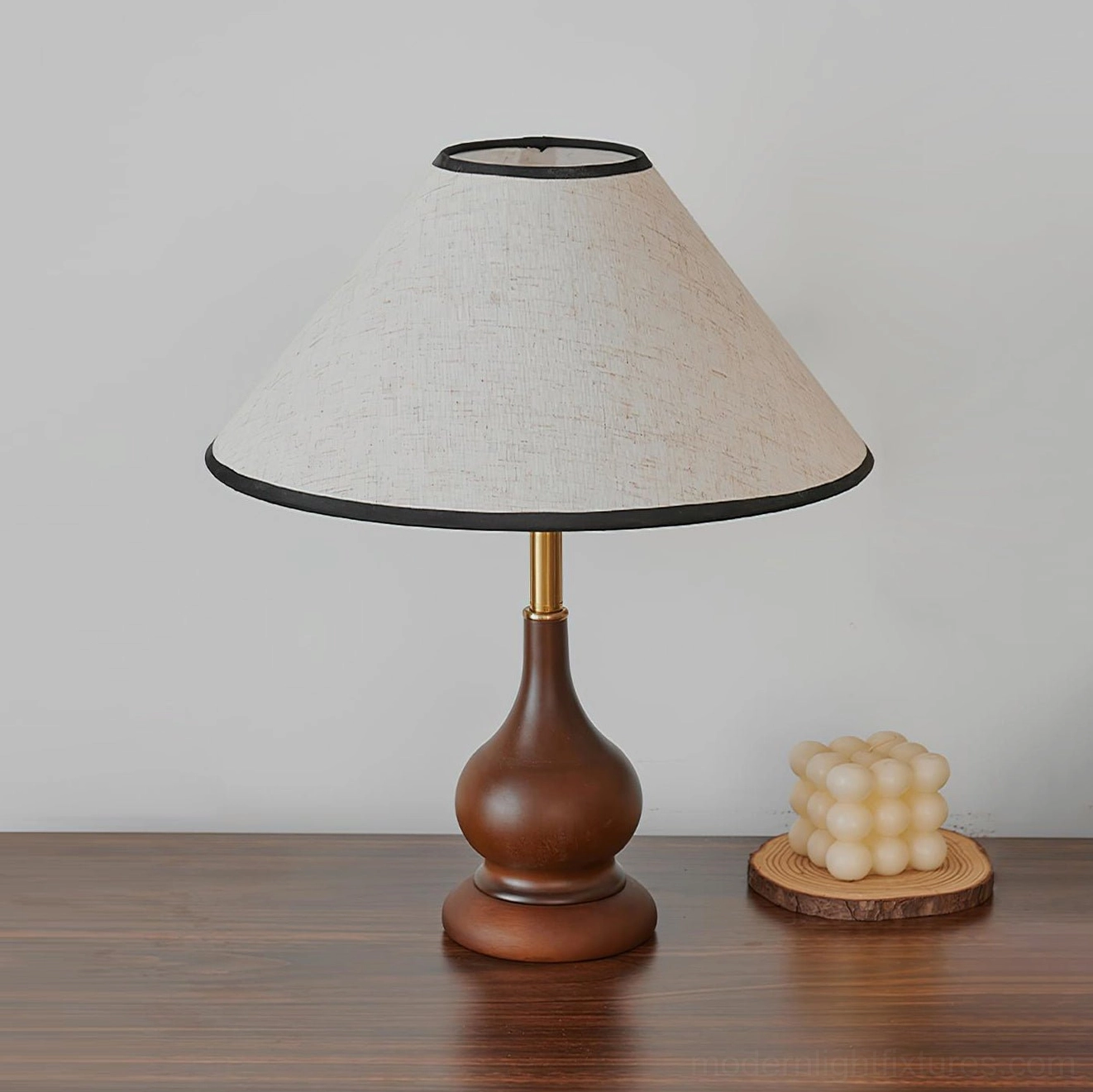 Lariat stitched leather table lamp with brass accents and sculptural wood base showcase
