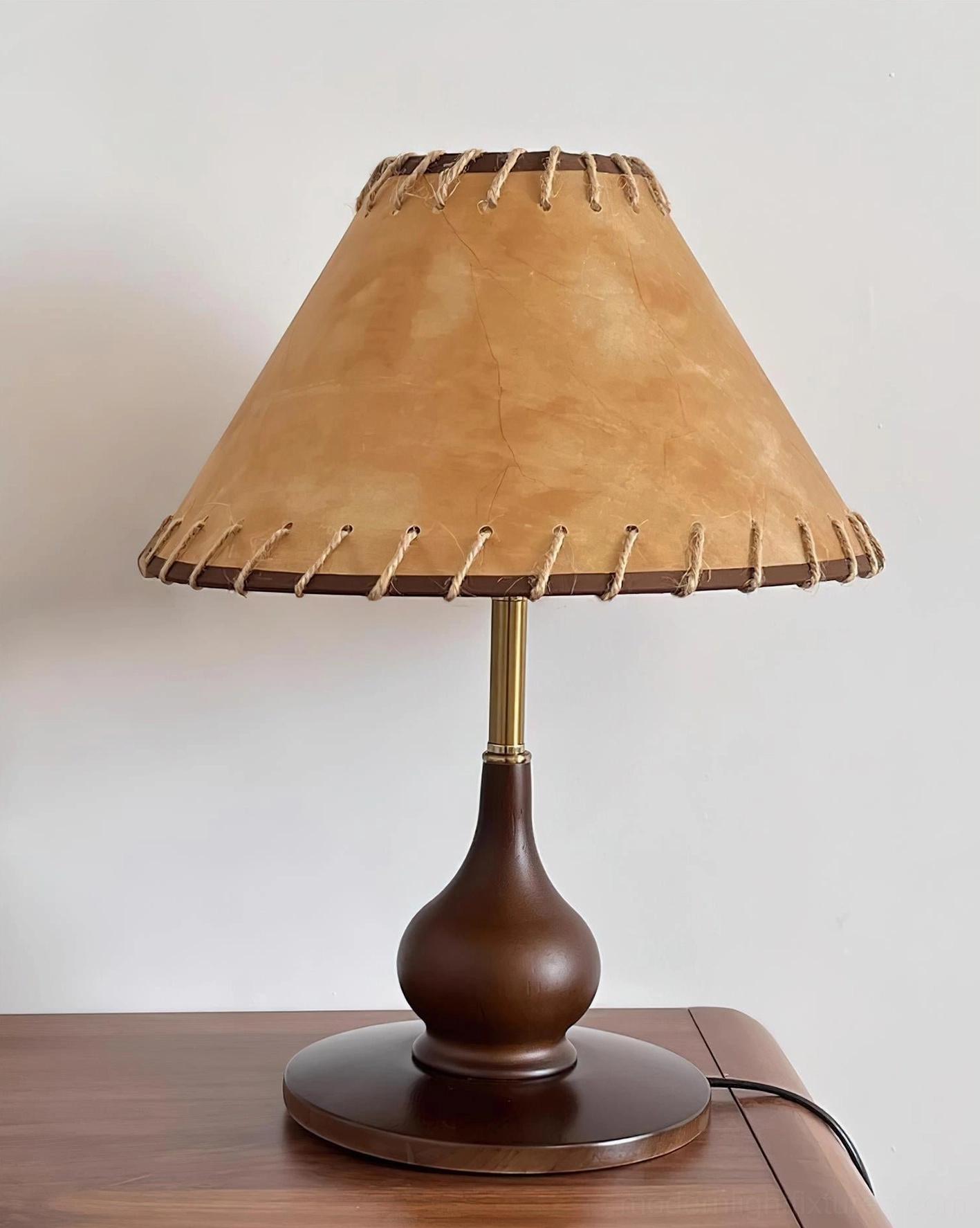 Lariat stitched leather table lamp with whipstitched trim and carved wood base detail