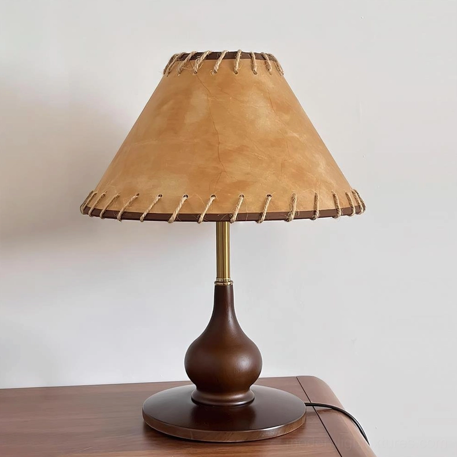 Lariat stitched leather table lamp with sculptural wood base and visible power cord