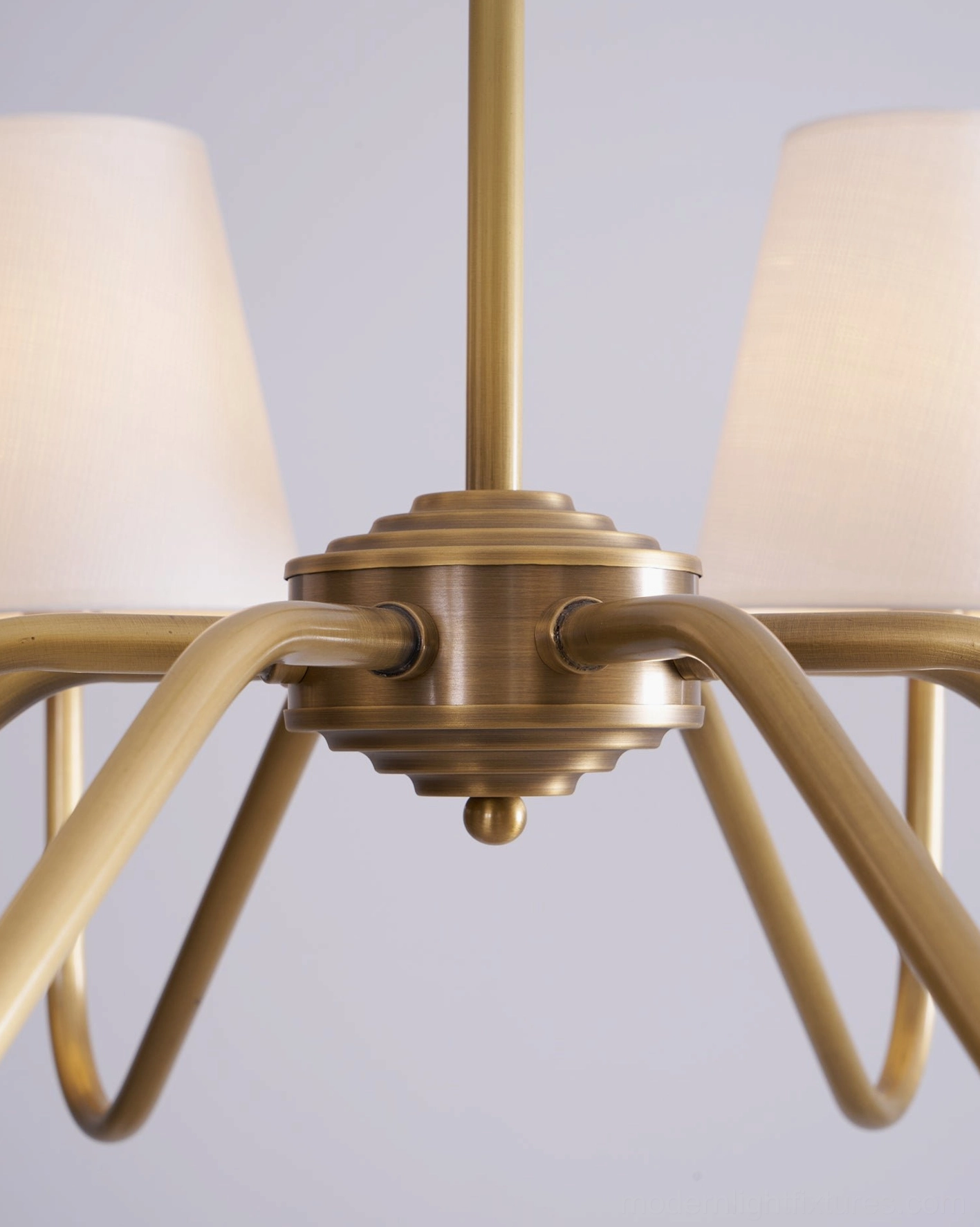 Lassen 8-head brass chandelier lifestyle image, luxury home interior, mid-century modern design statement