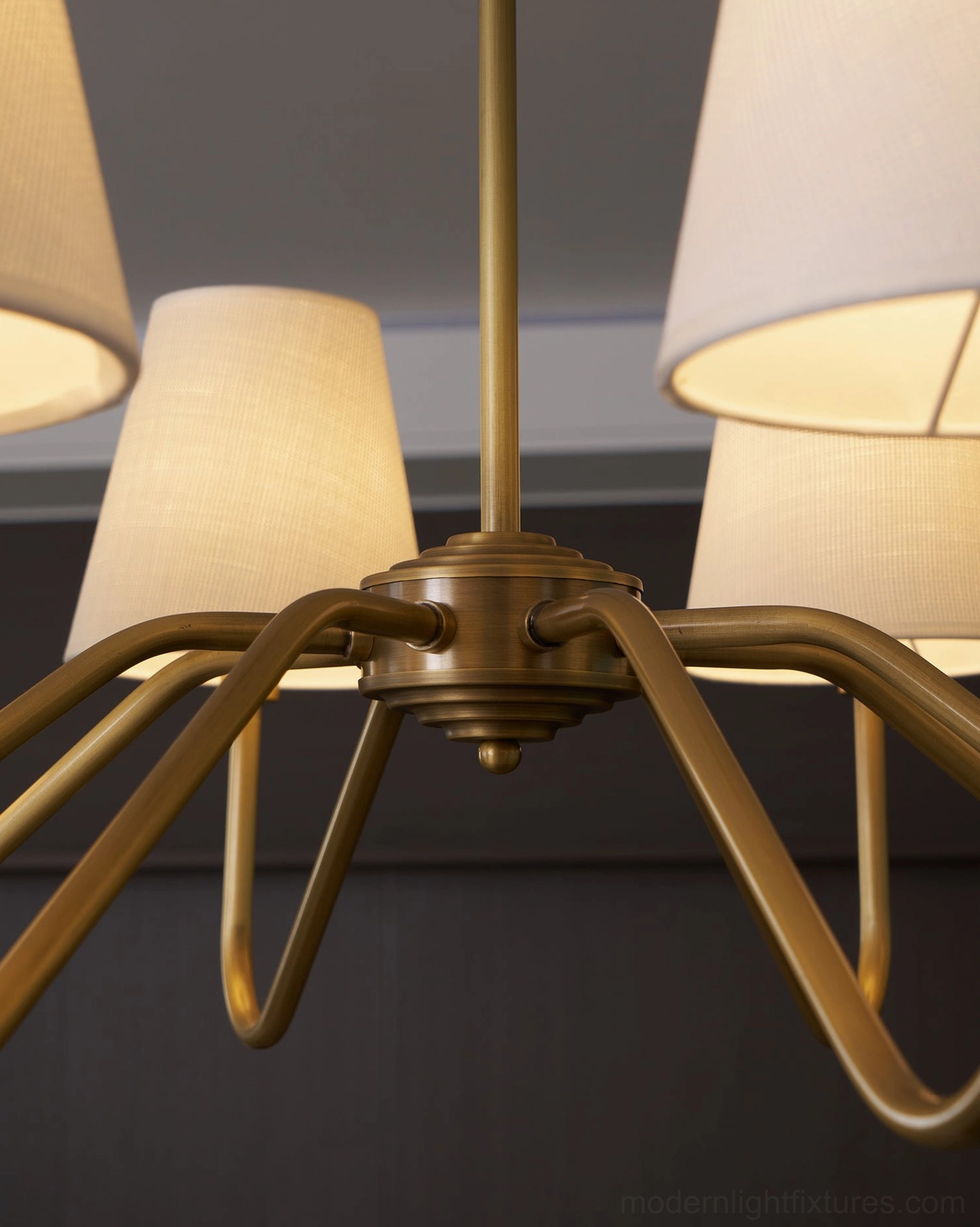 Lassen brass chandelier contemporary styling, modern living space, functional luxury lighting fixture