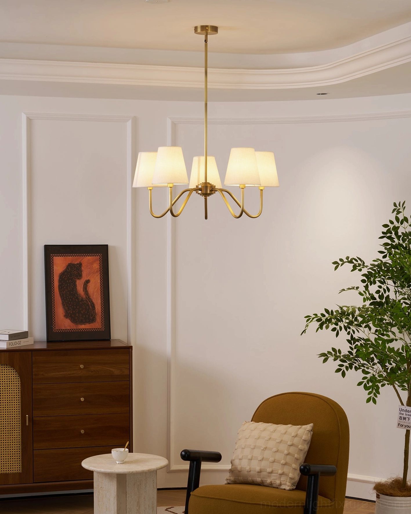 Lassen brass chandelier hanging position, installation view, room ambiance lighting demonstration