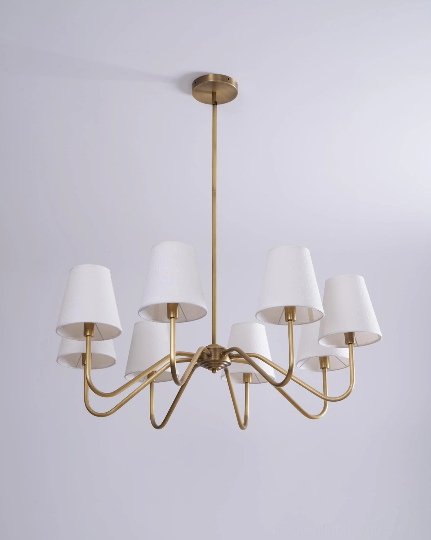Lassen brass chandelier modern home setting, room ambiance, mid-century fixture styling and placement