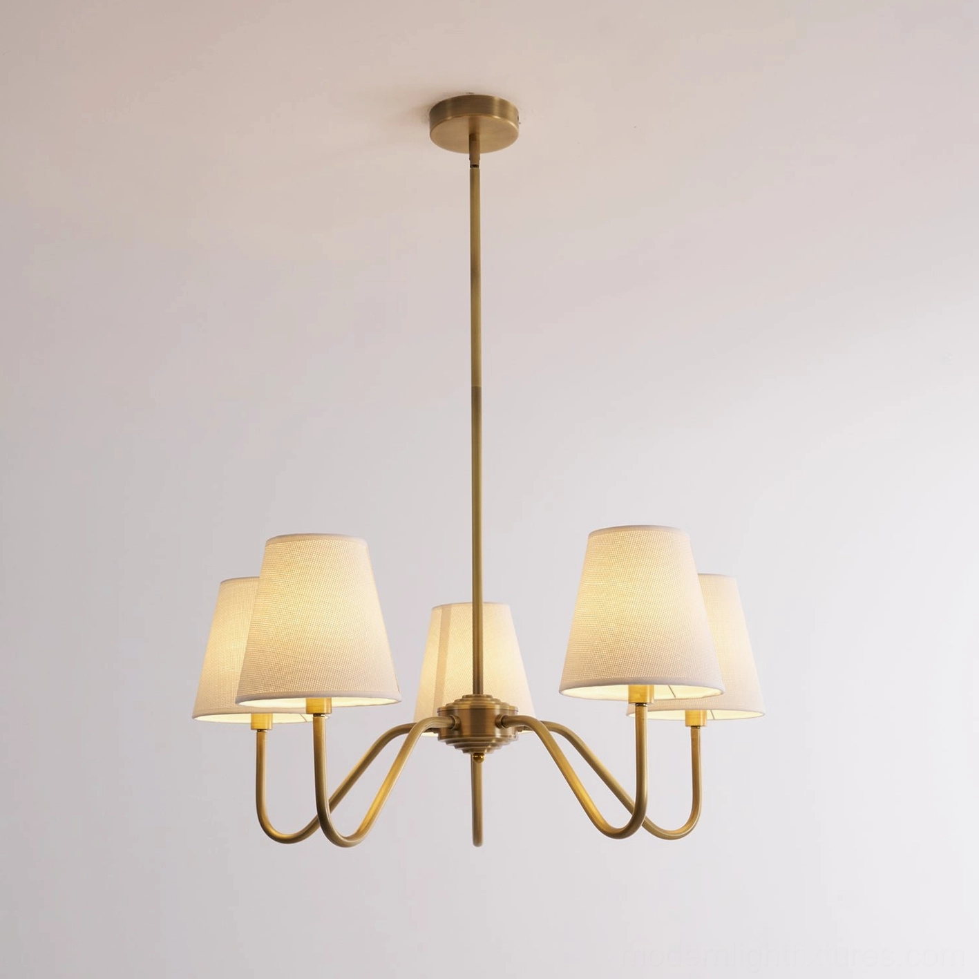 Lassen brass chandelier product showcase, mid-century modern design detail, brushed brass frame