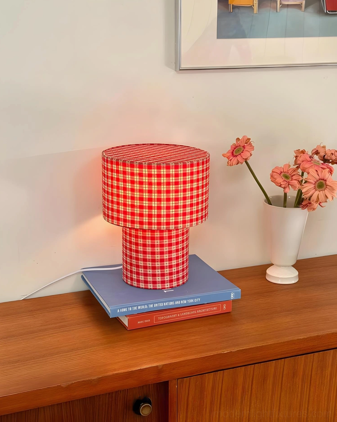 Lit red gingham latticefield table lamp wooden side table warm indoor home decor with flower accent